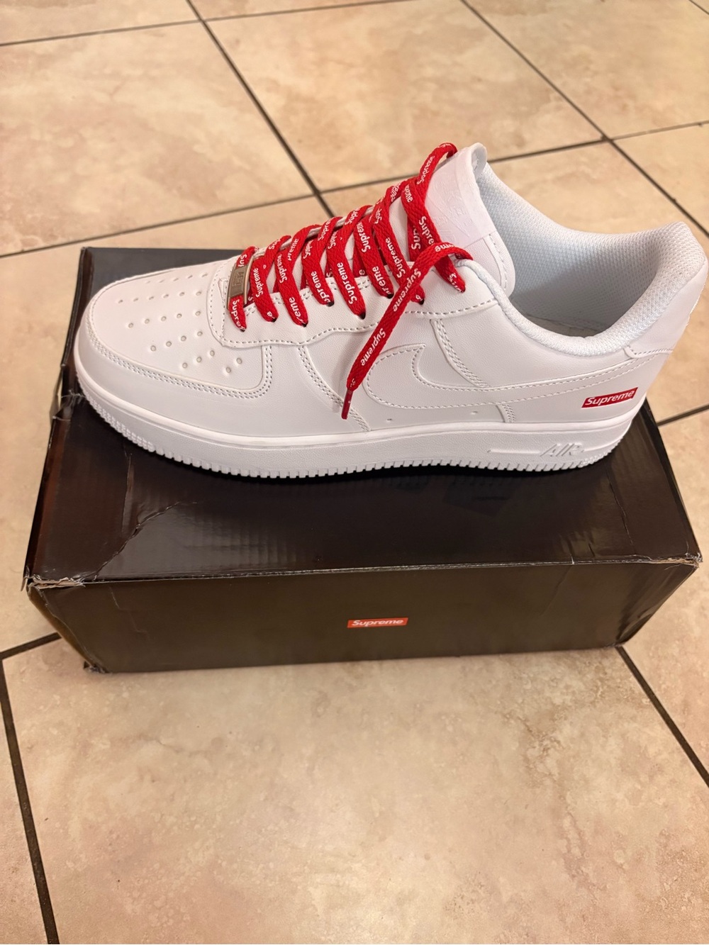 Supreme White Leather Low-Top Sneakers with Red Logo Laces